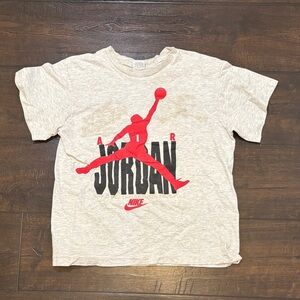 Nike Kids Short Sleeve Tee in Cream with Red and Black Graphic